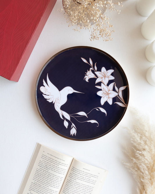 An elegant navy blue tray with floral and hummingbird on an aesthetic table perfect for home and gifts